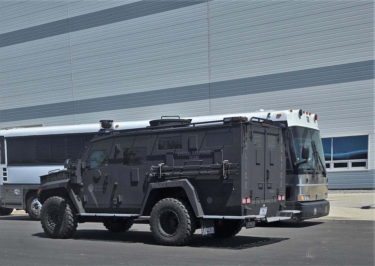 A Homeland Security Investigations (HSI) armored vehicle and an adhesive bus that is parked in front of the HL-GA battery company in the Hyundai Motor Group Motplant America Megasit in Ellabell, Georgia, on the morning of Thursday, September 4, 2025, when HSI and US immigration and customs officers were parked.
